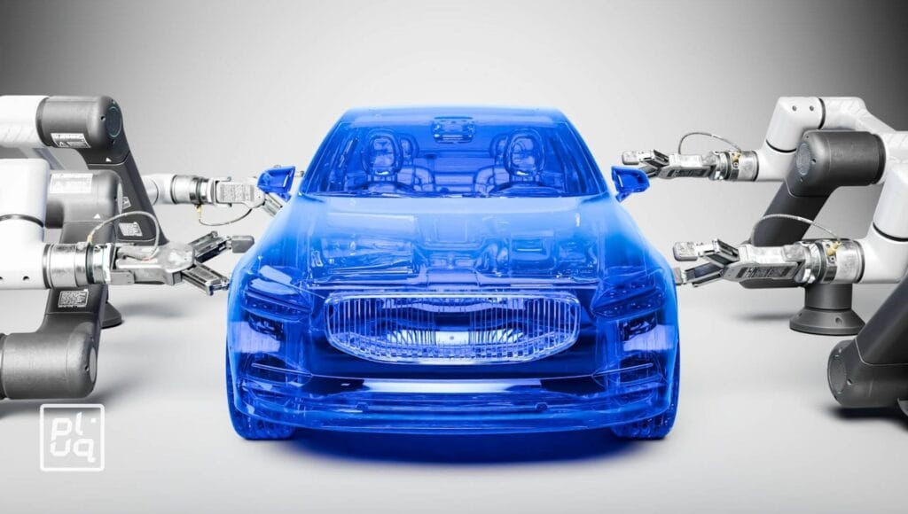 A transparent blue car model is surrounded by robotic arms on both sides, appearing to assemble or inspect it, against a neutral background. The scene suggests advanced automotive manufacturing or automation.