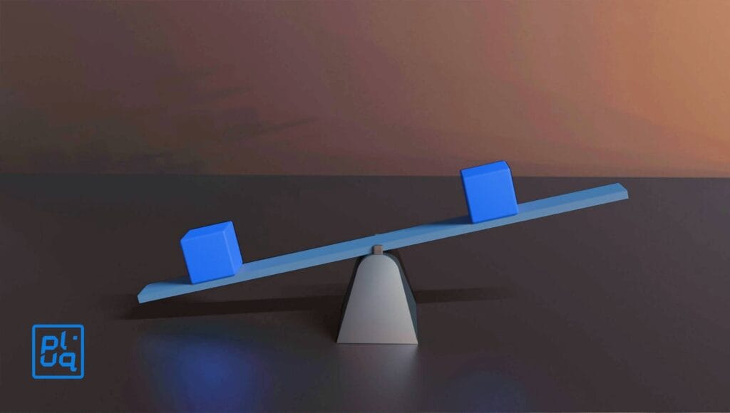 A blue seesaw balances on a triangular base with two blue cubes of equal size placed at different distances along its length, set against a muted, gradient background. A blue logo appears in the lower left corner.